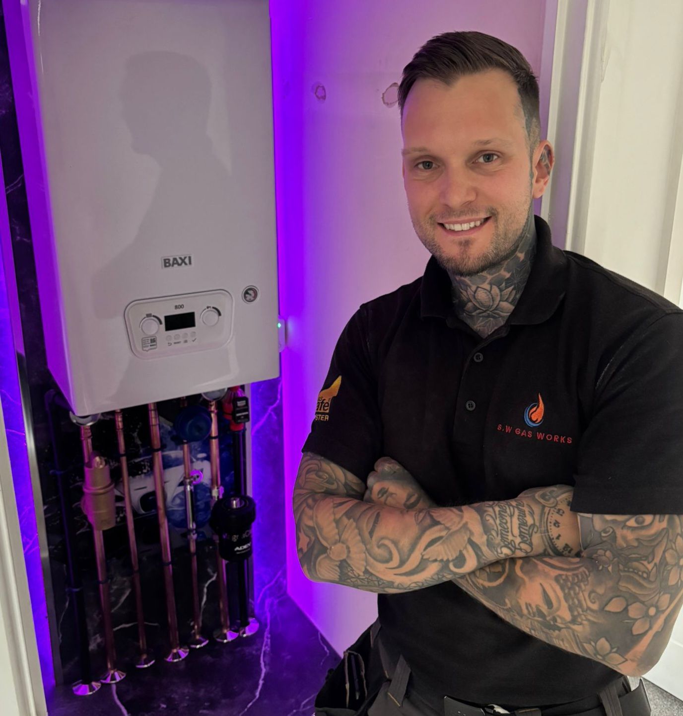 Sam Watt of S.W Gas Works beside a newly installed Baxi boiler